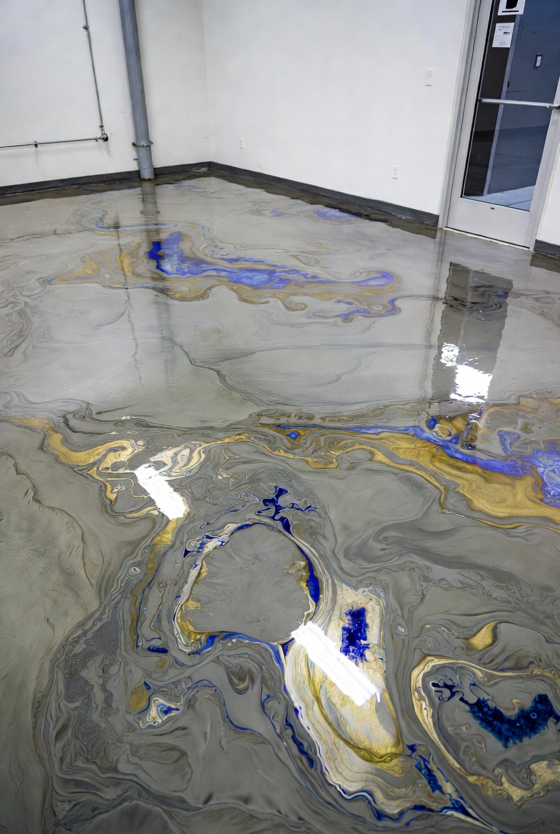 Professional commercial epoxy floor installation in auto shop service bay