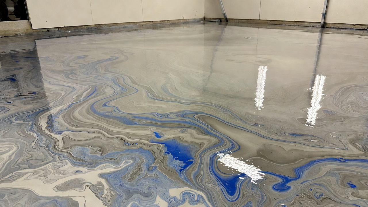 Metallic silver-blue epoxy garage floor with high-gloss finish in a two-car garage