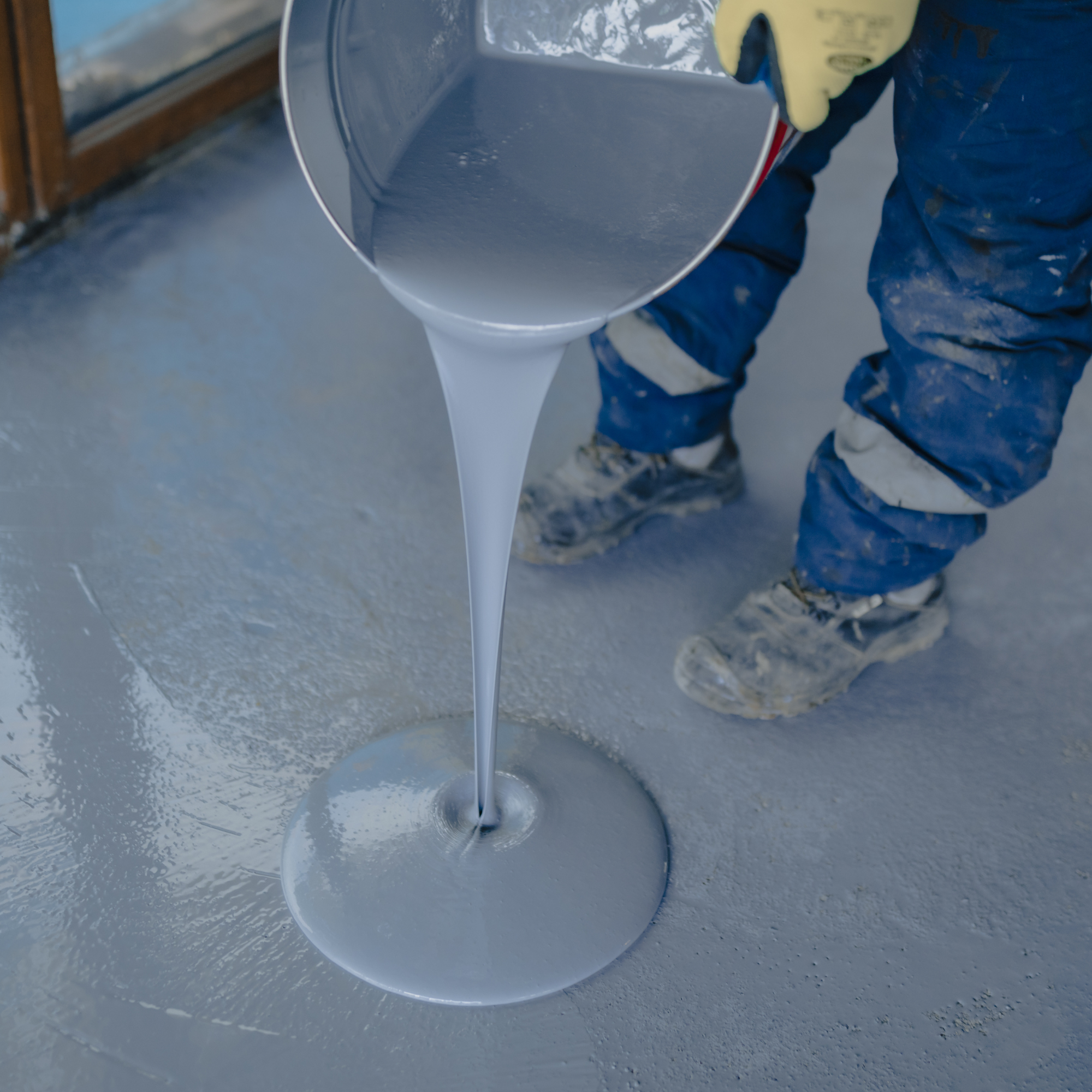 FEK Epoxy crew applying epoxy floor coating in a Saint Augustine garage