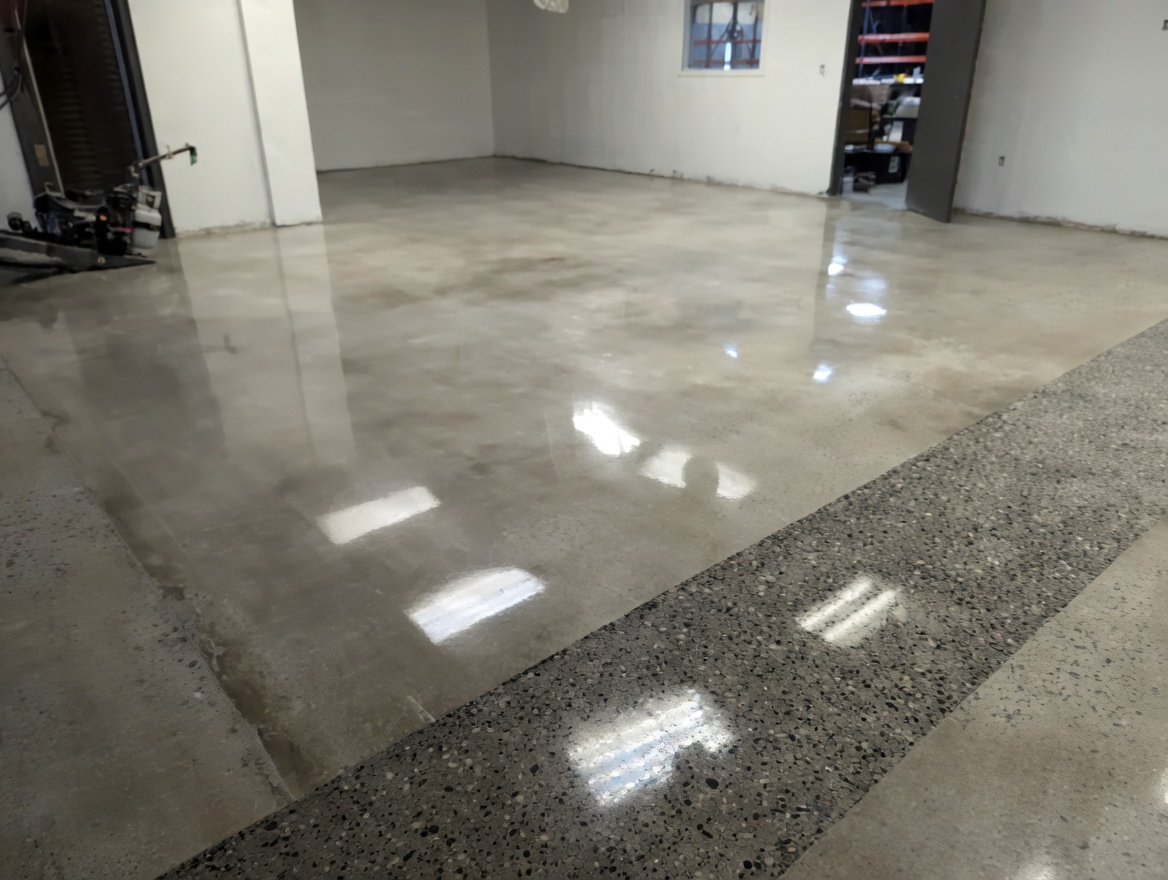 Polished concrete floor with high-gloss mirror finish in commercial warehouse